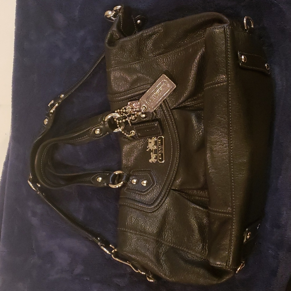 Black coach purse with detachable shoulder strap.